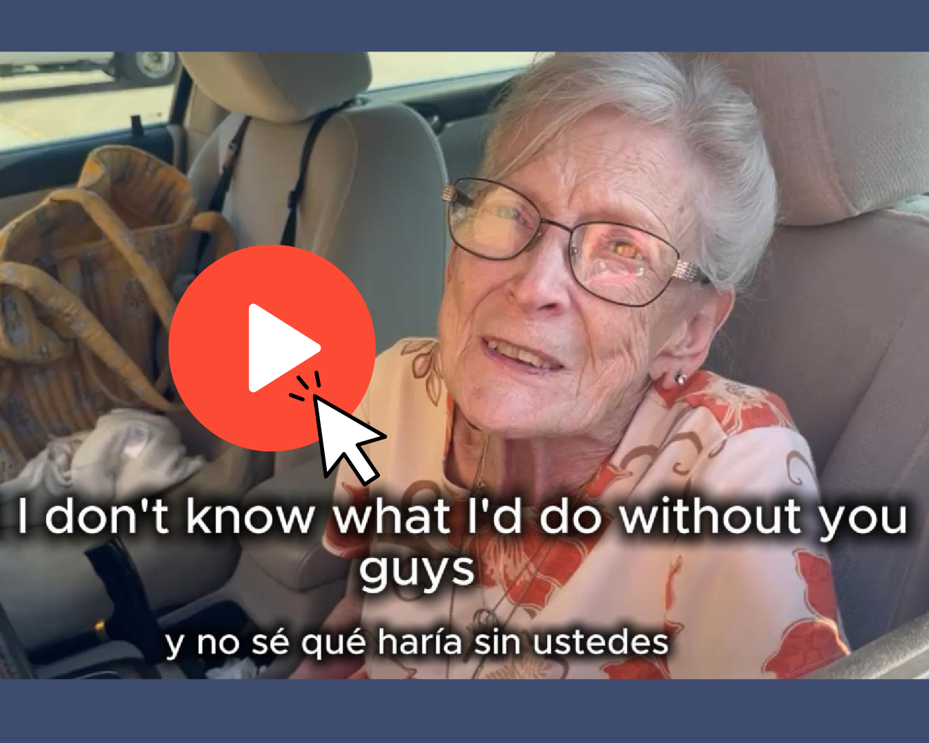 A woman with white hair and glasses looks up at the camera from where she sits in the front seat of her car.